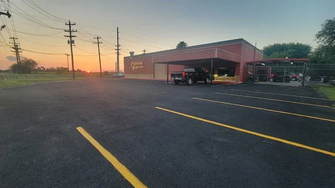 Collision Masters shop exterior at sunset